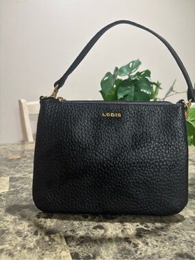 Lodis Black Pebbled Leather Wristlet with Gold Logo
